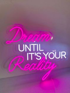 a neon sign that says dream until it's your reality