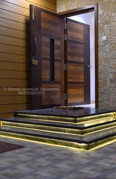 some steps that are lit up in front of a door