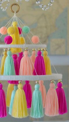 a chandelier with tassels hanging from it's sides and balls on top