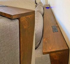 a wooden bench sitting on top of a couch next to a wall