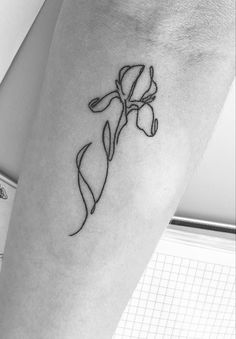 a black and white photo of a flower on the leg