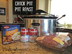 the crock pot is sitting on the kitchen counter next to some other food items