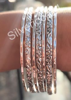 Set of 7 Bangles, 925 Sterling Silver Stacking Bangles For Women, Semanario, Stacking Bracelets, 7 Day Bangles, Half Round Bangles, Gifts Style Bangle/Bracelet Material : Silver  Bracelet Size Inches Circumference/Diameter   7 / 2.23 7.5 / 2.39 8 / 2.55 8.5 / 2.71 9 / 2.87 9.5 / 3 They are plain and simple and yet so elegant and shiny! We make them with a base of stainless steel so they hold up well with daily wear and rough use. These are WATERPROOF *Nickel and Lead-free Sizing: Choose the size Spiritual Silver Bangle For Anniversary, Silver Spiritual Bracelets For Anniversary, Bohemian Silver Personalized Bracelets, Silver Stackable Metal Bangle, Adjustable Hand-set Sterling Silver Bangle, Nickel-free Silver Spiritual Bangle, Bohemian Sterling Silver Nickel-free Bangle, Nickel-free Sterling Silver Spiritual Bangle, Stacked Bangles