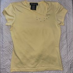 No Boundaries Juniors Size Small 3/5 Y2k Style Baby Tee/Cropped T-Shirt Asymmetrical Neckline Rhinestone Embellishments Like New This Yellow Shirt Is Super Cute And Screams Y2k. The Asymmetrical Neckline Is So Unique And Hard To Find. Dry Stylish Design With The Rhinestone Embellishments. Labeled A Juniors Small With A Lot Of Stretch. Would Look Great With A Pink Mini Skirt Or Jeans. It’s In Excellent Condition And Looks Brand New. I Have Lots Of Y2k And Fun Clothes On My Page, Bundle To Save! Yellow Fitted Y2k T-shirt, Yellow Fitted Y2k Top, Fitted Yellow Y2k Tops, Fun Clothes, Pink Mini Skirt, Yellow Shirt, Rhinestone Embellishments, Asymmetrical Neckline, Yellow Shirts