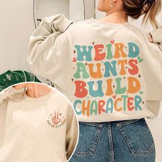 Join the exclusive league of Cool Aunts with our 'Weird Aunt Build Character' sweatshirt. Whether you're a seasoned aunt or celebrating your auntie era, this custom-designed crewneck is the ultimate expression of aunt pride. Ideal for gifting to new aunts, as a pregnancy reveal, or as a birthday surprise for your favorite aunt, this sweatshirt exudes charm and wit. Stand out from the crowd and showcase your aunt-hood with our personalized, funny, and promoted-to-aunt tee. Elevate your aunt's gam Best Auntie Gifts, Auntie Sweatshirt Ideas, Aunt Sweatshirt Ideas, New Aunt Gift Ideas, Cool Aunt Aesthetic, Aunt Aesthetic, Auntie Vibes, Aunt Sweater, Auntie Life