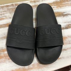 Questions? Leave A Comment Below! Worn Once. Practically Brand New. Casual Gucci Open Toe Slides, Gucci Casual Open Toe Slides, Designer Black Sandals With Rubber Sole, Black Gucci Sandals For Summer, Casual Black Gucci Slides, Black Casual Gucci Slides, Designer Black Slides With Cushioned Footbed, Black Designer Flat Slides, Gucci Black Sandals With Rubber Sole