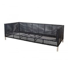 a black wicker couch with metal legs and an open back compartment on the side