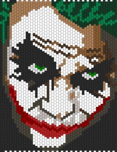 a cross stitch pattern of two jokers with green eyes and white face paint on them