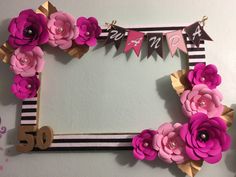 a birthday card frame decorated with paper flowers