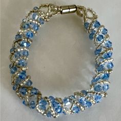 Beautiful Nwot Bracelet Featuring Light Blue Sapphire Swarovski Crystals, Seed Beads, And Silver Metal Magnetic Closure. Measures About 7.5” And Has Some Stretch To It. Lovely And Versatile! Lightweight And Easy To Put On And Take Off. From Smoke Free Dog Friendly Home. Blue Crystal Bracelet With Faceted Beads, Blue Crystal Bracelet For Party, Blue Crystal Round Beads, Adjustable Blue Bracelets With Sparkling Stones, Elegant Blue Crystal Beaded Bracelets, Elegant Blue Beaded Crystal Bracelet, Blue Crystal Bracelet With Silver Beads, Blue Crystal Bracelet With Round Beads, Blue Crystal Bracelet With Sparkling Stones