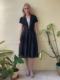 Super sweet printed black cotton dress with full skirt. Bust: 34"Waist: 25"Hips: freeLength: 44"Circa: 1950'sCondition: Good vintage condition. A bit of wear to the underarms where the print has somehow worn off a bit, nothing major. Several mends. The hem has come out of it's last fold but is still finished and looks fine. A hint of yellowing to the tuxedo part. Priced accordingly. For fun stuff--->>>@closetcasevintageinstagram.com/closetcasevintagePlease read our store policies. Brown Cotton Dress, Fifties Dress, Hippie Purse, Black Cotton Dresses, Tuxedo Dress, Haute Hippie, Full Skirts, Cotton Dresses, Black Cotton