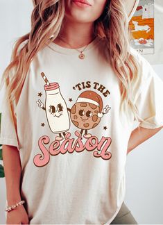 Retro/groovy milk and cookie tis the season T-shirt! It is perfect gift as a holiday apparel. Gildan is back with its garment-dyed t-shirt, a fully customizable tee made 100% with ring-spun cotton. The soft-washed, garment-dyed fabric brings extra coziness to your wardrobe while the relaxed fit makes it an excellent daily choice. The double-needle stitching throughout the tee makes it highly durable while the lack of side-seams helps the shirt retain its tubular shape. .: 100% ring-spun cotton . Cowgirl Halloween, Fleece Women, Comfort Colors Tshirt, Bride Shirt, Mama Shirts, Shirts Women, Comfort Color, Retro Halloween, Extra Room