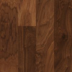 a close up view of the wood grains on this wooden flooring material, which is very dark brown