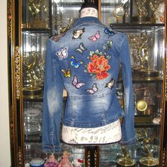 Beautiful Denim Jacket Adorned With Flower And Butterfly Appliqus. Moto Silhouette. Zipper Closure. Unlined. Made Of Cotton, Polyester, Spandex And Other Fiber. Brand New With Tags. Size Xs Trendy Denim Jacket With Floral Print, Trendy Floral Print Denim Jacket, Multicolor Denim Jacket For Spring, Spring Multicolor Denim Jacket, Blue Denim Jacket With Floral Print, Multicolor Denim Jacket With Patches For Spring, Multicolor Patched Denim Jacket For Spring, Fitted Blue Denim Jacket With Floral Embroidery, Fitted Denim Jacket With Patches For Spring