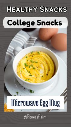 a white bowl filled with food on top of a plate next to an egg and fork