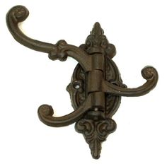 an ornate iron hook on a white background