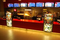 the inside of a fast food restaurant with many menus