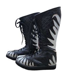 Step into the ring with confidence and style wearing our Handmade  Leather Wrestling Boots. Crafted with 100% genuine leather, these boots boast not only unparalleled durability but also a unique and luxurious aesthetic. The striking Silver color is accentuated by a fire-style leather layer, adding an extra dimension to your wrestling attire. Black Crocs Pattern  Textured with Silver  Fire Style.  Designed for optimum performance, these boots feature a lace-up style, allowing for a secure and cu Wrestling Attire, Wrestling Boots, Black Crocs, Luxurious Aesthetic, Mens Shoes Boots, Long Boots, Pro Wrestling, Handmade Leather, Work Boots