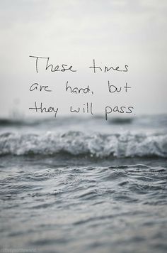 there is a quote written on the ocean water that says, those times are hard, but they will pass