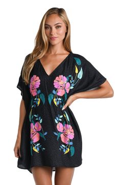 Model is wearing a black Summer Black Kaftan With Floral Embroidery, V-neck Floral Print Vacation Cover-up, Black Short Sleeve Beachwear Kaftan, Black Short Sleeve Kaftan For Beachwear, Black Printed V-neck Kaftan, Black Printed Short Sleeve Kaftan, Black Printed Kaftan With Short Sleeves, Black V-neck Tropical Dress, Black Floral Print Kaftan For The Beach