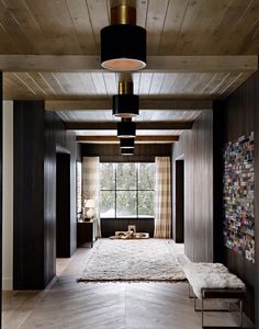 an instagramted post from urbanelectricco shows a hallway with wood paneling