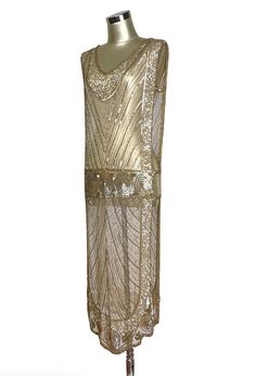 The tabard dress is one of the iconic designs of the 1920's - long beaded panels running down the front and back of the torso, linked by thin bands of shimmering sequins. Our Modernist Tabard is no exception! With endless variations, it can be worn over almost any shape of slip or dress to offer an entirely different look. The weight of the beading and sequins gives it an elegant drape which looks beautiful on all figures. Sheer, so a slip is recommended.  One size...panel width 18", bust band 3", hip band 3", length 43" Modern Flapper Dress, Gatsby Gown, Art Deco Gown, 1920s Glamour, Vintage Wrap Dress, 1920s Looks, Paneled Skirt, Silk Lingerie, Beaded Gown