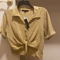 100% Cotton Tan Casual Cotton Blouse With Tie Waist, Casual Short Sleeve Blouse With Tie Waist, Casual Tied Top For Spring, Summer Brown Button-up Tops, Tan Button Up, Casual Button-up Tops With Tie Waist, Spring Button-up Tops With Tie Waist, Casual Button-up Tie Waist Tops, Khaki Button-up Top With Snap Buttons