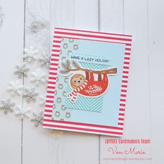 a card with a slotty bear hanging on a tree branch and snowflakes