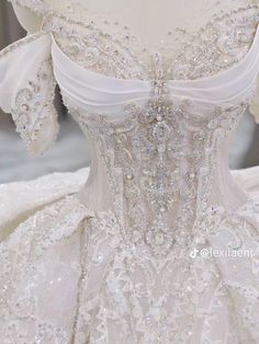 the back of a white wedding dress on display