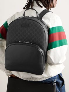 Gucci's monogram is rendered in an understated black and grey for this backpack, likely to match the majority of your suits and jackets. Made in Italy from the label's 'Supreme' coated-canvas, it's panelled with leather and has a spacious front zipped pocket to tuck your sunglasses, wallet and keys. Gucci Business Bag With Logo, Designer Gucci Leather Backpack, Designer Gucci Leather Travel Backpack, Gucci Leather Backpack For Travel, Luxury Gucci Backpack, High-end Black Backpack For Daily Use, Modern Gucci Bags With Zipper Closure, Black Gucci Bag With Logo, Gucci Standard Backpack For Daily Use