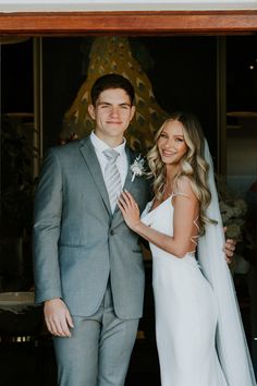 a bride and groom posing for a photo