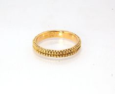 This is cast from a granulated original and is pictured in 14k yellow gold, but I can also cast this in Sterling or 18k yellow. Or would be happy to make a similar design for you in original 18k granulation!Granulation is a controlled fusing process that has been utilized for thousands of years. This unique surface will get more interesting with wear. The granules are individually placed and fused with a mouth torch. I then make a mold of the ring and pull a wax copy from that mold and cast it u Hand Forged 14k Yellow Gold Jewelry, Yellow Gold Nugget Brass Jewelry, Heirloom Hand Forged Yellow Gold Jewelry, Ceremonial Yellow Gold Hammered Jewelry, 14k Stamped Yellow Gold Nugget Jewelry, Ceremonial Hammered Yellow Gold Jewelry, Formal 22k Gold Hammered Jewelry, Ceremonial 14k Yellow Gold Jewelry, Ceremonial 14k Gold Jewelry With Diamond Cut