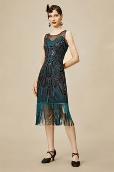 Find the vintage inspired 1920s Flapper dresses in BABEYOND. These authentic Gatsby themed dresses are designed to recall the classic. Always remember - truly eternally stylish flapper dresses would never go wrong. Free shipping on all orders and 14-day unconditional return. Festive Green Dress With Tassels, Festive Green Tassel Dress, Flapper Style Embellished Evening Dress, Festive Fitted Dresses With Tassels, Flapper Dresses With Beaded Fringe For Party Season, Elegant Green Flapper Dress For Party, Sequin Sleeveless Flapper Dress, Sleeveless Sequin Flapper Dress, Green Fringe Party Dress