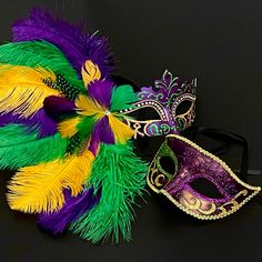 The vibrant purple mask adorned with luxurious mardi feathers represents the splendor and elegance of the carnival. Multicolor Mardi Gras Masquerade Masks, Mardi Gras Mask For Themed Events, Multicolor Eye Mask For Mardi Gras, Multicolor Masquerade Mask For Mardi Gras Carnival, Mardi Gras Feathered Masquerade Mask For Party, Mardi Gras Multicolor Masquerade Mask For Carnival, Mardi Gras Masquerade Mask With Feathers For Party, Purple Masquerade Mask For Carnival And Halloween, Mardi Gras Party Masquerade Mask With Feathers