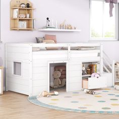 a child's bedroom with a loft bed and toys on the floor in front of it