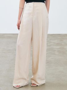 These linen blend pants have wide, straight silhouette in long length. Voluminous tucked detail adds to the refined, sophisticated mood. - Intended for a loose fit- Classic hook and eye closure- Logo embroidery at side and logo patch detail at back- Pleated detail through front for added volume- Versatile styling with various items Linen Blend Pants, Wide Pants, Logo Embroidery, Embroidery Logo, Long Length, Linen Blend, Patch Logo, Loose Fitting, Trousers