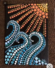 an octopus painting on a black canvas with orange and blue dots in the background,