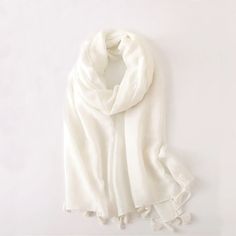 This Cotton Linen Light Scarf is the perfect accessory for adding a pop of color and elegance to any outfit. It's soft, lightweight, and versatile, so you can wear it as a traditional scarf in the cold seasons, wrap it sarong-style for a beach day or just use it with a styling purpose. Available in three stunning colors, pink, ivory and watermelon-red, it's a must-have for any wardrobe that loves to wow. Material: lightweight cotton Size: 35inches X 72inches Sarong Style, Linen Lights, Watermelon Red, Pink Ivory, Cold Season, Sarong, Beach Day, Cotton Linen, Watermelon