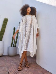 Lace Crochet Midi Dress For Beach, Beach Midi Crochet Lace Dress, Beach Crochet Midi Dress In Lace, Beach Crochet Lace Midi Dress, Long White Midi Dress For Vacation, White Long Midi Dress For Vacation, Lace Maxi Dress Beach Cover-up, Flowy Lace Midi Dress For Vacation, Spring Vacation Midi Length Kaftan