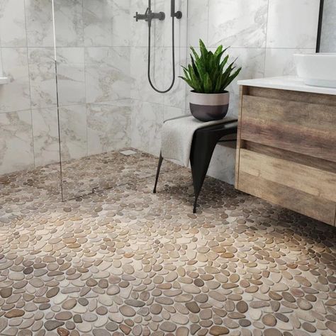 LEVEL PEBBLE meshes the aesthetic of our Perfect Pebble with the flawless flat surface of our Random tiles. It is the ideal solution for customers who require a flatter surface yet desire the appearance of natural pebble. Utilizing our original interlocking pattern this addition to our Pebble Series opens up a new realm of surfacing possibilities. Pebble Floor Shower Ideas Farmhouse, Pebble Floor Shower Ideas, River Rock Bathroom, Stone Shower Floor, River Rock Shower, Stone Floor Bathroom, Pebble Tile Shower, Pebble Shower Floor, Rock Shower