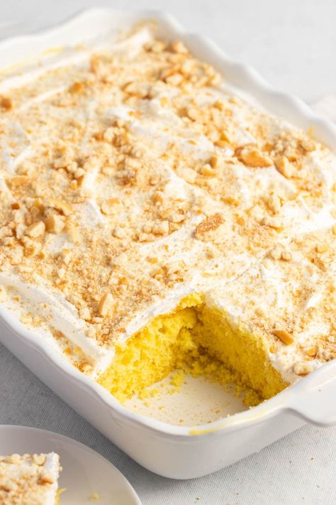 This banana pudding poke cake is a delicious twist on the classic Southern dessert. It's just as sweet and creamy but way easier to make. Yellow Poke Cake Recipes, Yellow Poke Cake, Banana Poke Cake, Cake Easy Recipe, Banana Desserts, Yellow Cake Mix Recipes, Banana Pudding Poke Cake, Pudding Poke Cake, Recipes Using Cake Mix