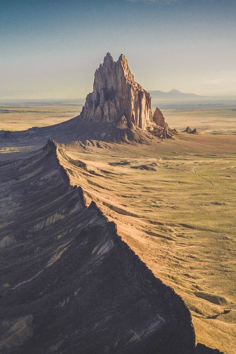 I think this might be one of the most beautiful places in New Mexico. This is Shiprock near Farmington. It's a kind of hard to access destination but you can see this view for miles and miles. #Travel | #NewMexico | #Shiprock Ship Rock New Mexico, Shiprock New Mexico, Farmington New Mexico, New Mexico Road Trip, Travel New Mexico, Mexico Beaches, Scenic Places, Explore Mexico, Mexico Travel Guides