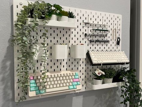 pegboard with keyboard displays Ikea Pegboard Office, Aesthetic Pegboard, Skådis Ikea, Ikea Pegboard, Workspace Essentials, Ikea Wall, Gamer Room Decor, Desk Inspiration, Dekorasi Kamar Tidur