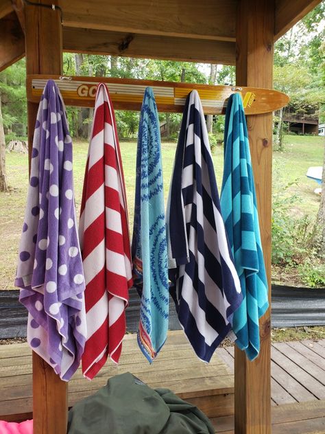 Lakehouse Beach Landscaping, Cabin Towel Rack, Lake Bar Ideas, Lake Towel Drying Rack, Dock Decor Ideas, Dock Storage Ideas Lake Houses, Lake House Towel Storage, Lake House Towel Rack, Lake Cabin Outdoor Ideas