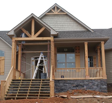 Give your home an exterior facelift by replacing worn or dated porch railings with custom wood railings topped by an overhead structure. Description from homekingdom.tk. I searched for this on bing.com/images Peaked Porch Roof, Peaked Roof Front Porch, Porch With Peaked Roof, Exposed Beams Front Porch, Off Center Door Front Porch, Front Porch Exposed Beams, Double Peak Roof Front Porches, Post And Beam Front Porch, Peaked Front Porch