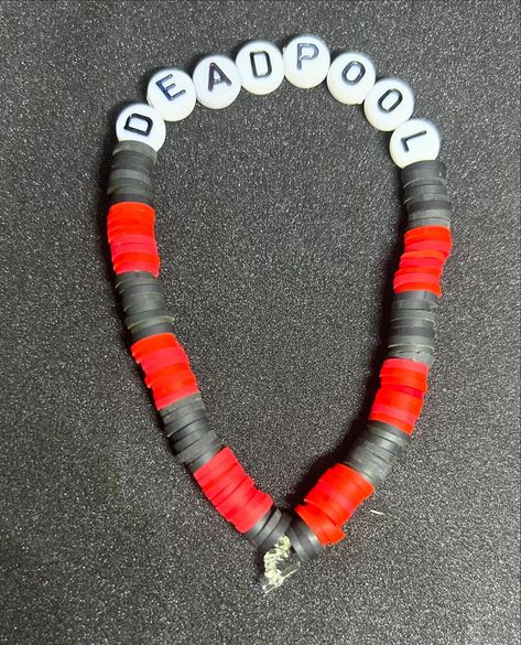 Deadpool (Superheroes) Heishi Bracelet #handmadebracelet #heishibracelets #beadedbracelets #bracelets #superheroes #superhero #deadpool #deadpoolfan #deadpoolcomics #deadpoolbracelets #deadpoolbracelet Heishi Bracelet, Deadpool Comic, Dead Pool, Bead Ideas, Clay Bead, Pretty Jewellery, Clay Beads, Handmade Bracelets, Deadpool