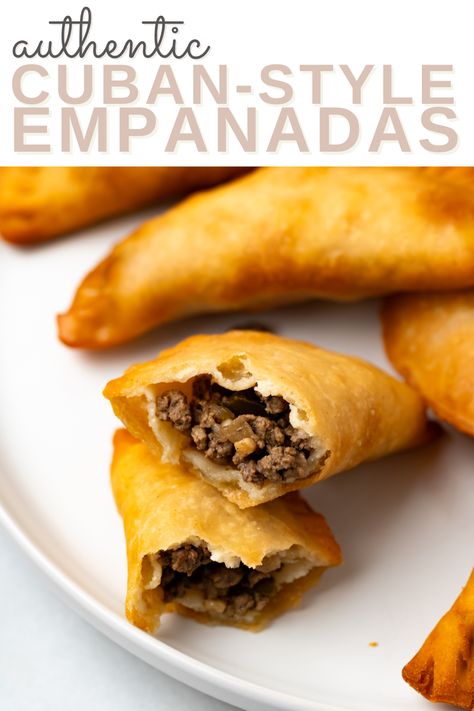 A beef filled cuban empanadas made with homemade empanada dough with more empanadas on the same plate with the words "authentic cuban-style empanadas" in the foreground Cuban Empanadas Recipe, Cuban Empanadas, Cuban Rice And Beans, Empanada Dough, Pumpkin Flan, Guava Paste, Cinnamon Simple Syrup, Empanadas Dough, Cuban Dishes