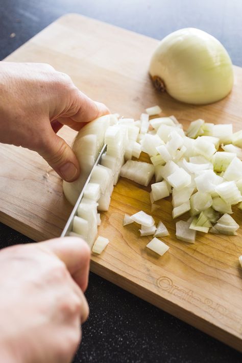 A properly cut onion starts with a sharp knife and the right technique. Our step by step guide explains how to mince, dice, or chop an onion for recipes. Butternut Squash Bisque, How To Cut Onions, Vegetable Scraps, Bawang Bombay, Veggie Stock, Cooks Illustrated, No Cooking, Vegan Soups, Diced Onions