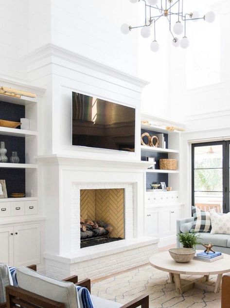 Fireplaces With Raised Hearth, White Fireplace With Hearth, Fireplace With Bench And Built Ins, Fireplace Next To Hallway, Keeping Room Fireplace, Tall Fireplace Surrounds, Fireplace Surround Built Ins, Raised Brick Hearth, Fireplace With Trim To Ceiling