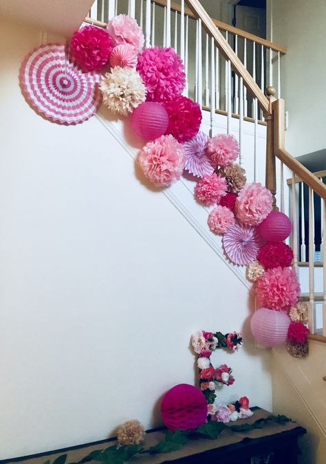 Paper poms, fans, and lanterns for baby’s first birthday party Tissue Paper Arch Pom Poms, Paper Pom Pom Decorations Party Ideas, Paper Fans Backdrop, Pom Pom Birthday Party Decorations, Party Door Decoration, Paper Fan Birthday Decorations, Paper Fan Decor, Pom Pom Backdrop, Paper Pom Pom Decorations